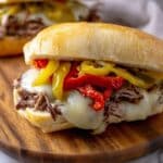 Italian Beef Sandwiches with Melty Cheese, Pepperoncini, and Flavorful Broth Recipe