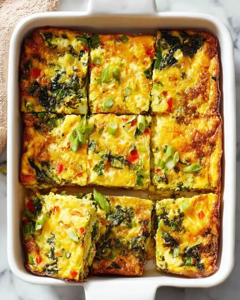 Hearty Breakfast Casserole with Roasted Potatoes, Veggies, Eggs, and Cheddar Recipe