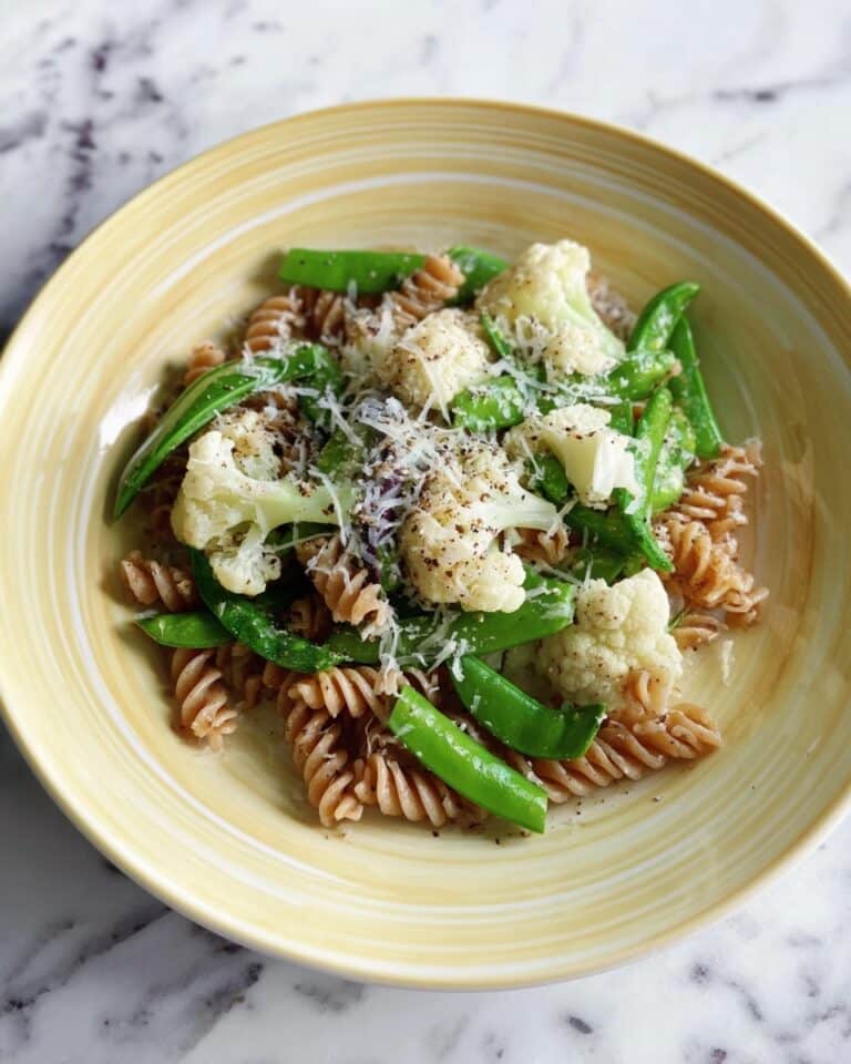 Garden Vegetable Pasta Bowl with Cauliflower, Snap Peas, and Garlic Scapes Recipe