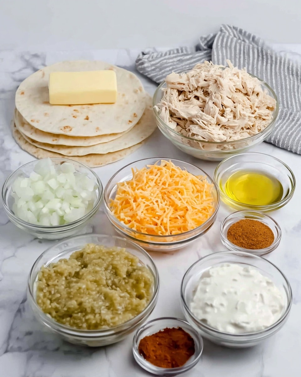 The image shows a collection of clear glass bowls with different ingredients arranged on a white marbled surface. There is one larger bowl at the back filled with shredded light beige chicken. In front of it, there is a medium bowl with shredded orange cheese, and another similarly sized bowl with a bright green chunky sauce. To the left, one medium bowl contains chopped white onions, and a smaller bowl has a pale yellow stick of butter. Next to the butter is another small bowl with reddish brown powder. On the right side, a medium bowl is filled with white sour cream, and a tiny bowl holds yellow oil. Behind all the bowls are three white flour tortillas stacked on a gray and white striped cloth. photo taken with an iphone --ar 4:5 --v 7