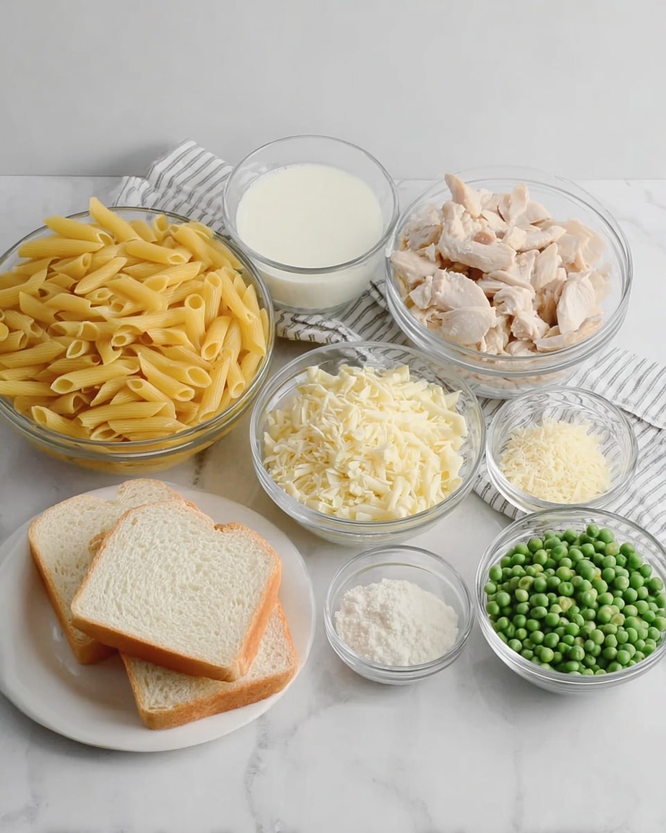 The image shows several clear glass bowls and a white plate arranged on a white marbled surface with a soft striped cloth underneath. There are seven clear glass bowls: one large bowl filled with yellow cooked penne pasta, another large bowl with light beige cooked chicken pieces, a medium bowl with white sauce, a smaller bowl filled with green peas, and three small bowls with grated cheese, white powder, and minced garlic respectively. Next to these bowls is a white plate holding two slices of white bread. The scene is simple and well-lit, emphasizing the natural colors and textures of the ingredients. Photo taken with an iphone --ar 4:5 --v 7