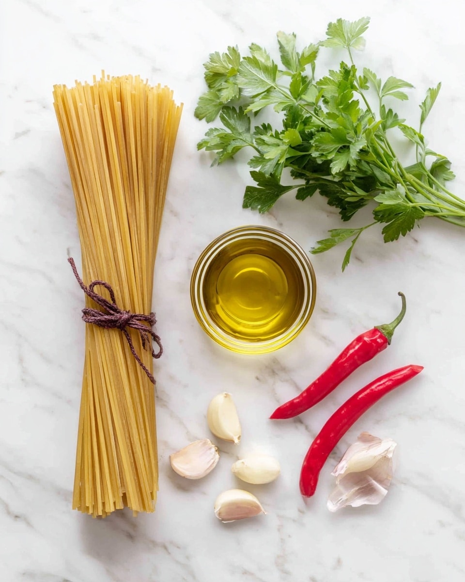 The image shows a flat lay of cooking ingredients on a white marbled surface, including a bundle of uncooked spaghetti tied with a dark brown string on the left side, a clear glass cup filled with golden olive oil placed in the center, a small bunch of fresh green parsley positioned at the top right, three bright red chili peppers on the far right, and six peeled garlic cloves arranged near the bottom center. photo taken with an iphone --ar 4:5 --v 7
