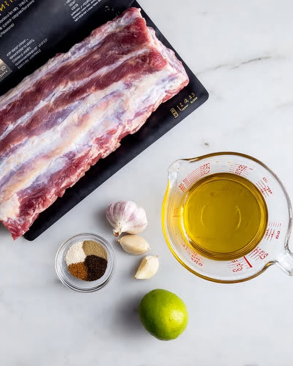 A slab of raw ribs with visible layers of pink and white fat rests at the top on black packaging with white text. Below it, on a white marbled surface, there is a small clear bowl containing three spices with colors brown, black, and pale pink. Next to it lies a whole green lime and three peeled garlic cloves, which are smooth and off-white. To the right, there is a clear measuring cup filled with a golden yellow liquid, likely oil, with measurement markings on the side. The scene is lit softly and arranged neatly. photo taken with an iphone --ar 4:5 --v 7