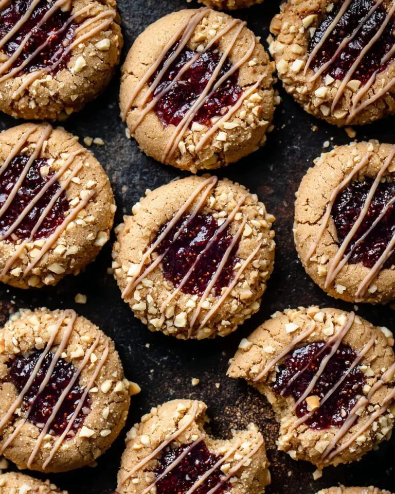 Peanut Butter Jam Thumbprint Cookies with White Chocolate Drizzle Recipe