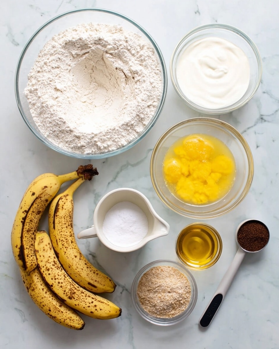 The image shows a top view of baking ingredients neatly arranged on a white marbled surface. In the center, there is a large clear glass bowl filled with white flour with a small well in the middle. To the right of it, two smaller clear bowls hold thick white yogurt and golden yellow melted butter. Below, a clear bowl contains beaten eggs with a yellow-orange color. On the left side, three ripe bananas covered in brown spots lay together, showing their yellow and brown-speckled skins. Near the bottom, there is a small white cup with baking soda, a small black and white measuring spoon with vanilla extract, and a small clear bowl filled with crushed nuts that have a light brown crumbly texture. photo taken with an iphone --ar 4:5 --v 7