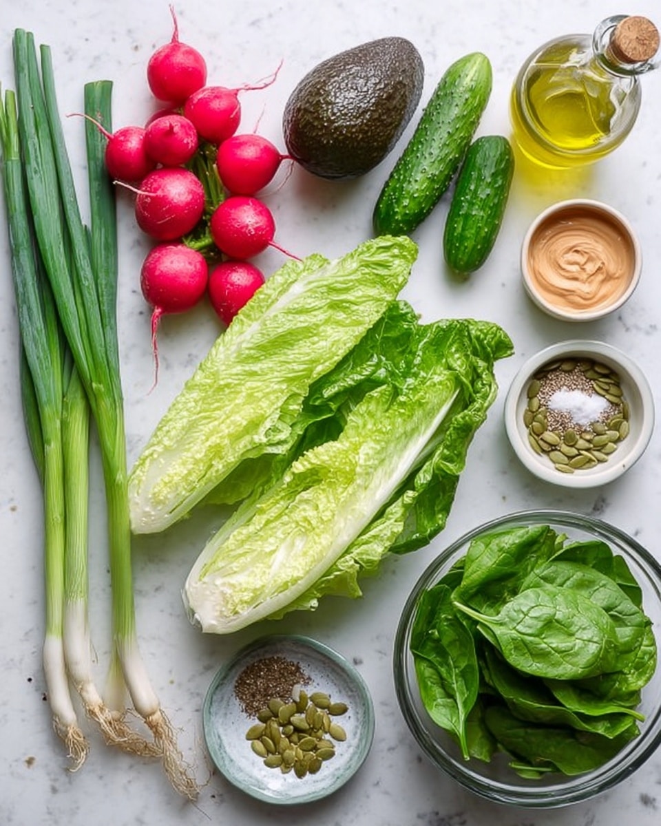 The image shows fresh ingredients laid out neatly on a white marbled surface, including a cluster of green onions on the left, two small green cucumbers, four radishes with bright red skin, and a whole dark green avocado. At the center, there are two halves of a romaine lettuce with vibrant light green leaves and firm white ribs. A glass bowl filled with fresh spinach leaves is placed to the right, along with smaller bowls containing light brown creamy mustard, green pumpkin seeds, and a light reddish-brown liquid. There is also a small bowl holding salt, black pepper, and beige powder, next to a glass bottle of light yellow oil. Photo taken with an iphone --ar 4:5 --v 7