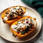 Stuffed Butternut Squash with Tempeh, Wild Rice, and Garlic Tahini Sauce Recipe