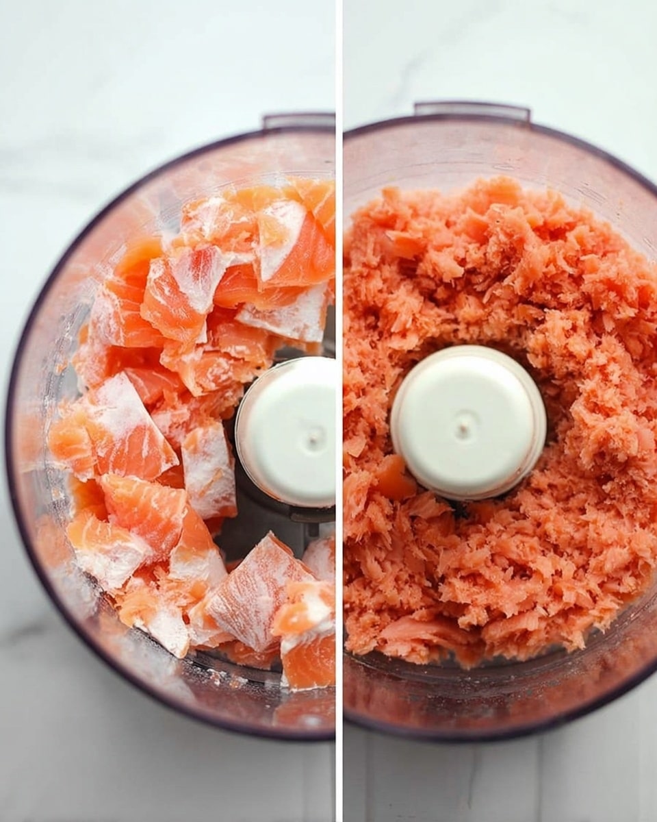 The image shows two close-up views side by side of a transparent food processor on a white marbled surface. On the left, the food processor bowl is filled with uneven pieces of bright orange and pale pink raw salmon, with white layers and skin patches visible. On the right, the salmon is finely chopped into a uniform, soft-textured pinkish-orange mixture, showing small bits and even blending around the central white blade. Photo taken with an iphone --ar 4:5 --v 7