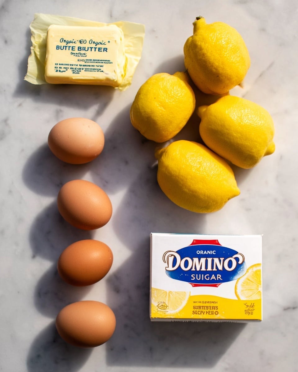 The image shows a white marbled surface with six brown eggs arranged in a loose vertical line on the left side. To their top left, there is a block of butter in yellow paper packaging labeled 