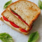 Mozzarella Sandwich with Basil Pesto, Tomatoes, and Roasted Red Peppers Recipe