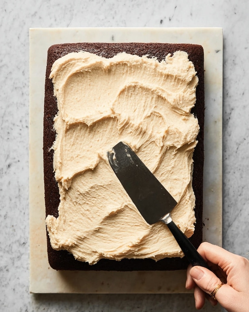 A collage of three images shows the process of making a chocolate cake. The top-left image is a clear glass bowl with dark brown batter inside, thick and smooth in texture, with two metal beaters partially submerged. The top-right image shows the same bowl with the batter halfway mixed, some white flour on one side and partly mixed chocolate batter on the other, with the beaters resting in the center. The bottom image shows a square glass baking dish with a fully baked chocolate cake, its top dark brown and slightly cracked, with a firm texture. All are placed on a white marbled surface with brown eggs and a striped kitchen towel nearby. photo taken with an iphone --ar 4:5 --v 7