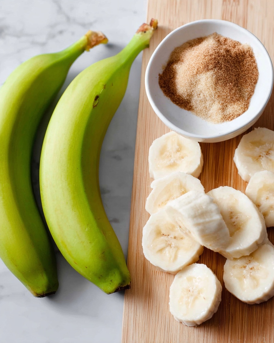 The image shows two fresh green bananas placed side by side on a white marbled surface on the left, next to a small white bowl filled with light brown sugar and a sprinkle of cinnamon on top. On the right, there are several thick slices of banana laid out on a light wooden cutting board, showing a soft white texture inside. Photo taken with an iphone --ar 4:5 --v 7