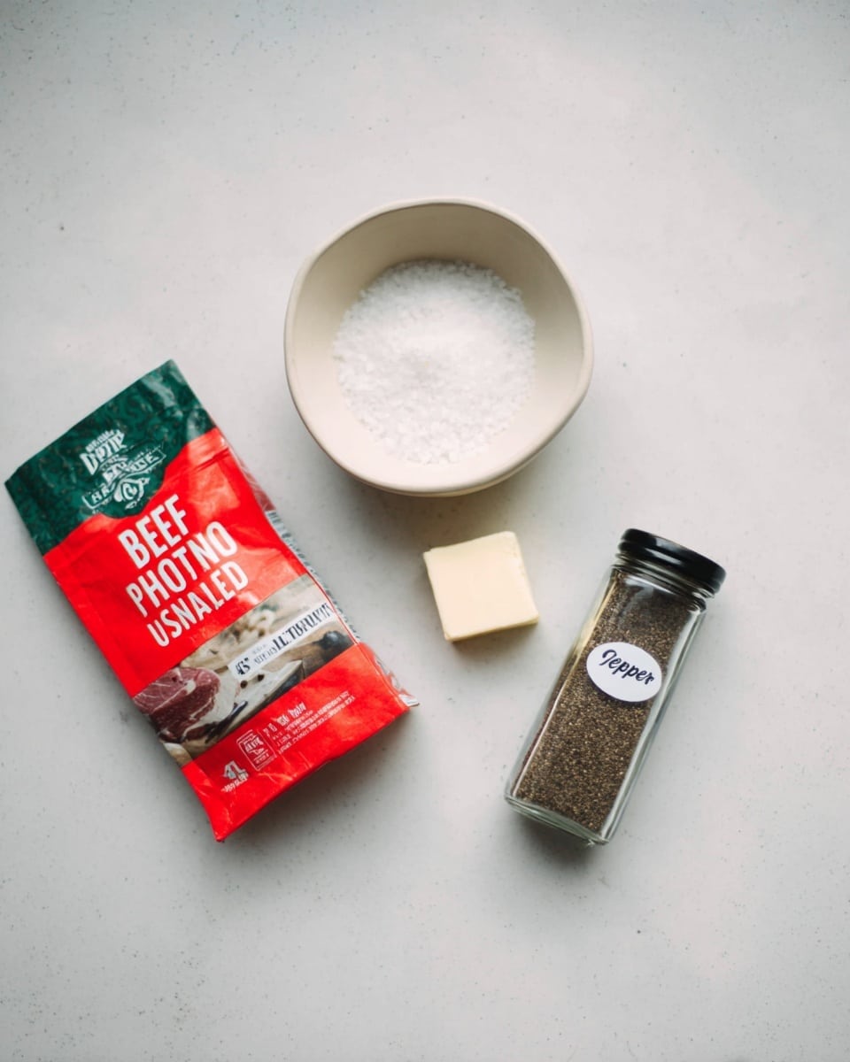 The image shows four cooking ingredients placed on a white marbled surface: a red and green packet labeled