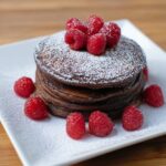 Chocolate Pancakes with Fresh Fruit and Powdered Sugar Recipe