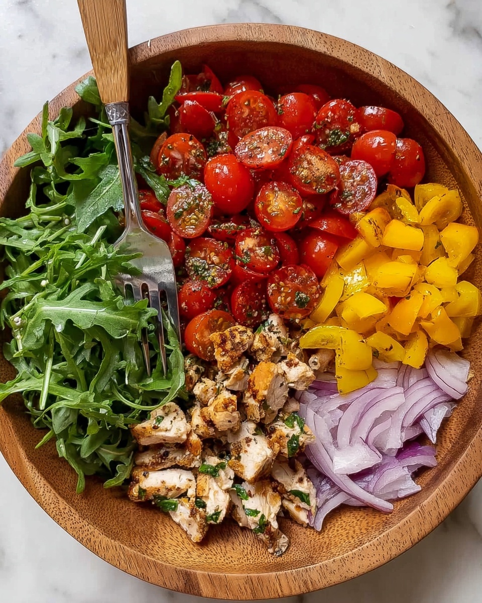 A wooden bowl holds five distinct layers of ingredients arranged side by side: on the left is a pile of fresh, dark green arugula leaves with a fork resting on top, next to it are grilled chicken strips in light golden brown with char marks, followed by a heap of halved cherry tomatoes in bright red with a sprinkle of herbs and spices, then diced yellow bell peppers adding a vibrant yellow color, and finally thinly sliced red onions with a pale purple hue on the right side; the bowl sits on a white marbled surface. photo taken with an iphone --ar 4:5 --v 7