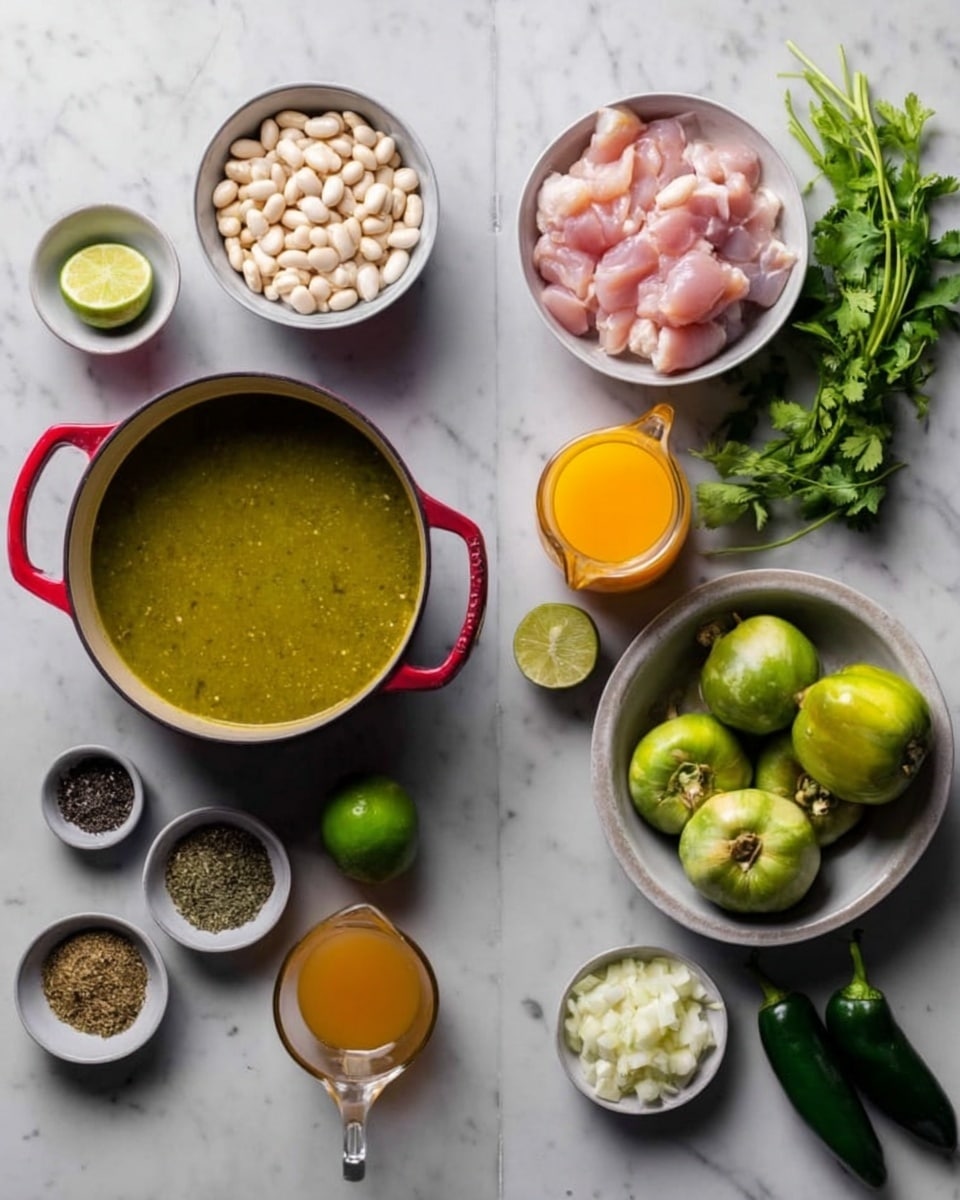 The image shows two sets of ingredients on a white marbled surface. On the left side, there is a white bowl filled with small white beans at the top left and a white bowl with pink raw chicken pieces at the top right. Below them, a large pot with red handles is filled with a green sauce. To the left of the pot is a halved lime and to the right is a small bowl of black pepper. Below the pot is a small bowl with mixed green and brown spices, and next to it is a glass measuring cup with orange liquid. On the right side, at the top is a bunch of fresh green herbs, and beside it a glass jug with orange liquid. Below are two dark green peppers next to a white bowl filled with halved green tomatillos. To the right of the tomatillos is a small bowl of chopped white onions, and below that is a small white bowl of orange liquid and a single green chili pepper. Photo taken with an iphone --ar 4:5 --v 7