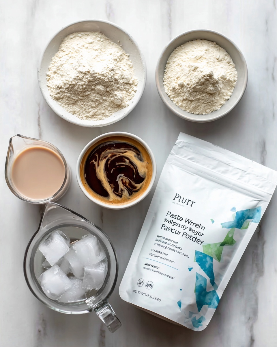 The image shows a white marbled surface with four items arranged neatly. At the top center, there is a small white bowl filled with a dark brown coffee with light cream swirls. To the top left, a white bowl contains off-white powder, likely protein powder. Below that, to the left center, a clear glass pitcher is filled with light pink liquid. At the bottom center, a white bowl is full of clear ice cubes. On the right side, a white bag labeled