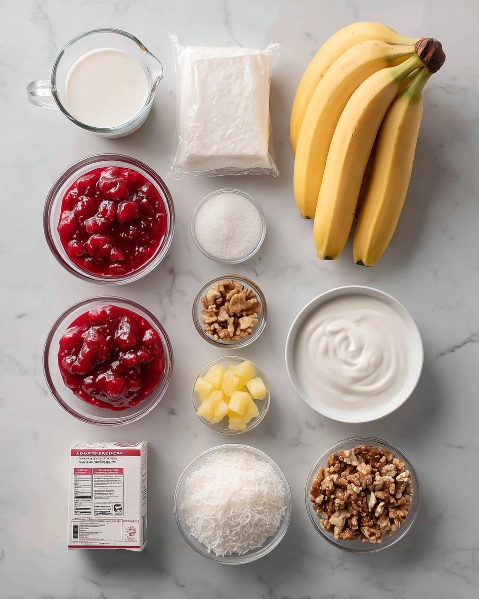The image shows a collection of ingredients arranged neatly on a white marbled surface, including two clear bowls filled with bright red cherry pie filling placed near the center; a stack of three yellow bananas with brown stems to the right; a small white bowl holding smooth, white cream; a glass measuring cup with white milk, positioned near a white plastic-wrapped package; two small clear bowls containing light yellow crushed pineapple; a small clear bowl with chopped brown nuts; a box of JELL-O vanilla pudding mix lying flat near the front; and a clear bowl filled with white shredded coconut. All items are spaced evenly, creating a clean and organized look photo taken with an iphone --ar 4:5 --v 7