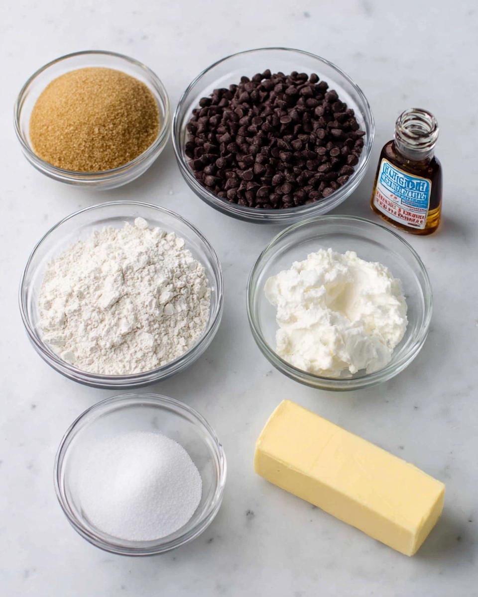 Seven small clear glass bowls and a stick of butter are on a white marbled surface. From left to right, the first bowl has light brown sugar with a grainy texture. Next is a bowl filled with dark brown chocolate chips. The center bowl contains white flour with a powdery texture. To the right of that is a bowl of white granulated sugar. Beside it is a smaller bowl with white salt. Behind the salt bowl is a small bowl of white creamy sour cream. On the far right is a stick of yellow butter next to a clear bottle of vanilla extract with a blue and white label. The overall arrangement is neat with each ingredient clearly visible. Photo taken with an iphone --ar 4:5 --v 7
