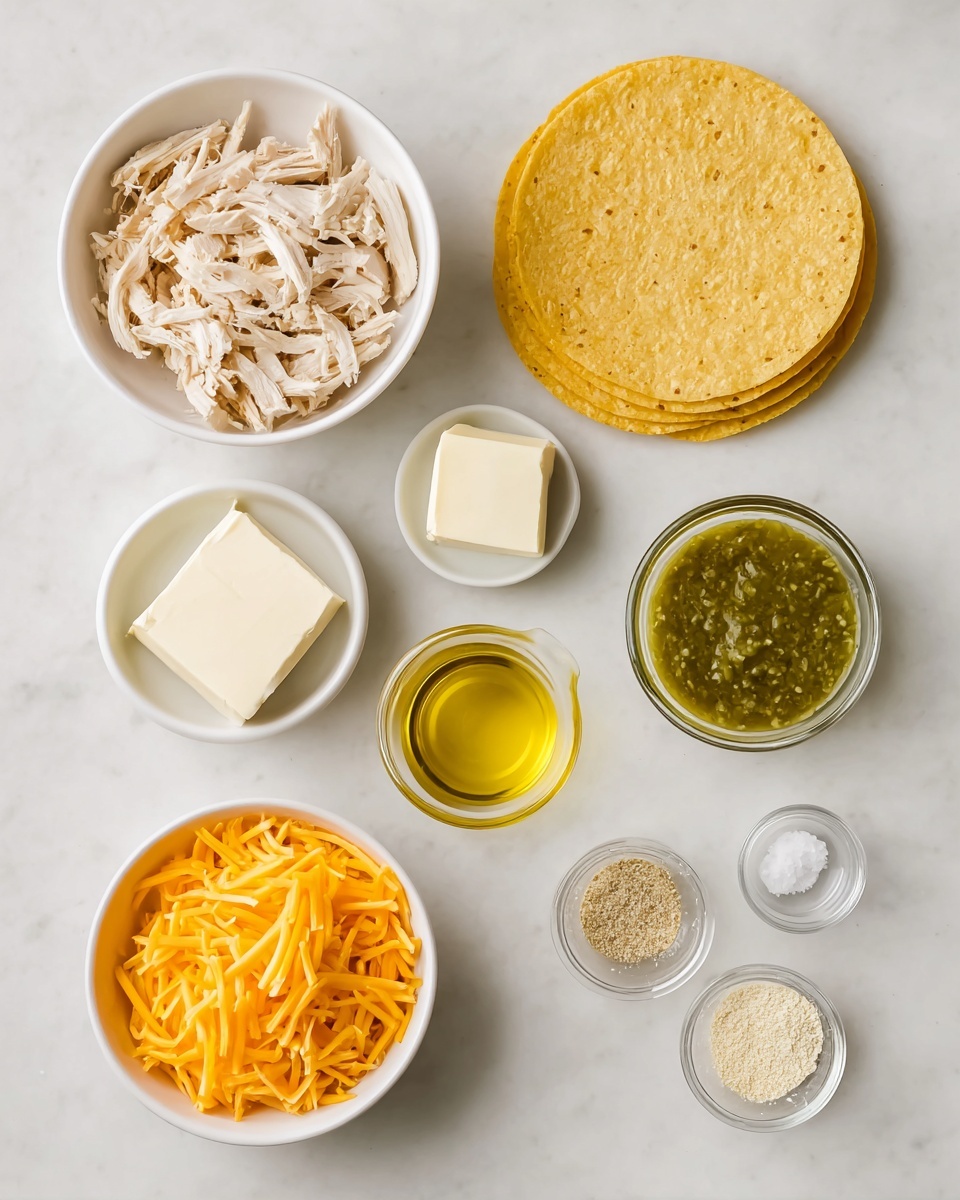 The image shows a flat lay of cooking ingredients arranged neatly on a white marbled surface. At the top left, there is a white bowl filled with light beige shredded chicken pieces. To the right, there is a stack of four yellow corn tortillas. Below the chicken, two small white bowls each hold a square of cream cheese, and next to them, in the center, a small white bowl contains green salsa. To the right of the salsa, a small glass cup holds a golden yellow liquid, likely oil. Below the oil, a larger white bowl is filled with bright orange shredded cheddar cheese. At the bottom right, two small glass bowls contain light-colored granulated spices, one beige and one white. The objects are arranged in a balanced, organized way with a clean, simple look. Photo taken with an iphone --ar 4:5 --v 7