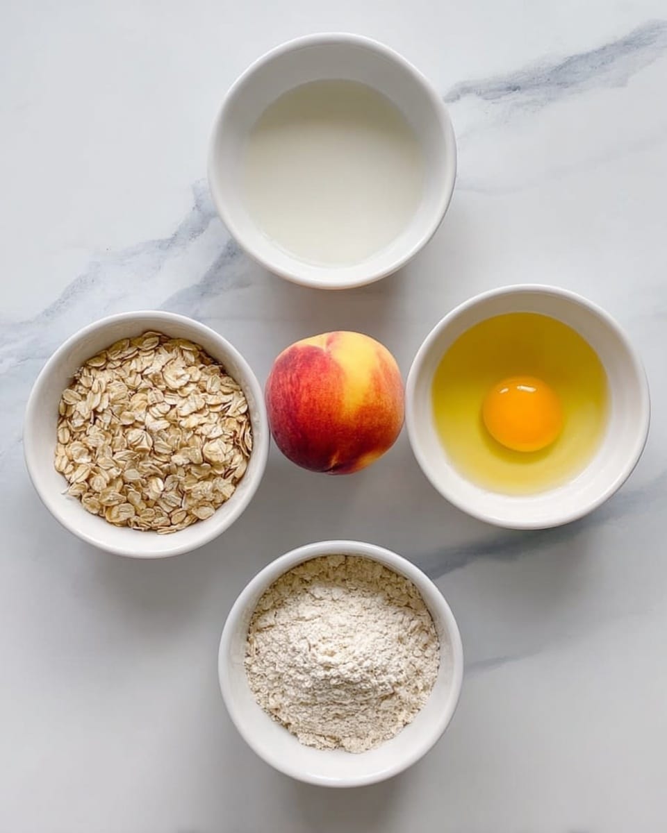Five white bowls arranged in a circle on a white marbled surface, each holding a different ingredient. At the top left is a bowl filled with white liquid, top right shows a bowl with a raw yellow egg yolk inside clear liquid, bottom left has pale rolled oats, bottom right contains light beige flour, and in the center of the circle sits a whole peach with red and yellow skin. photo taken with an iphone --ar 4:5 --v 7