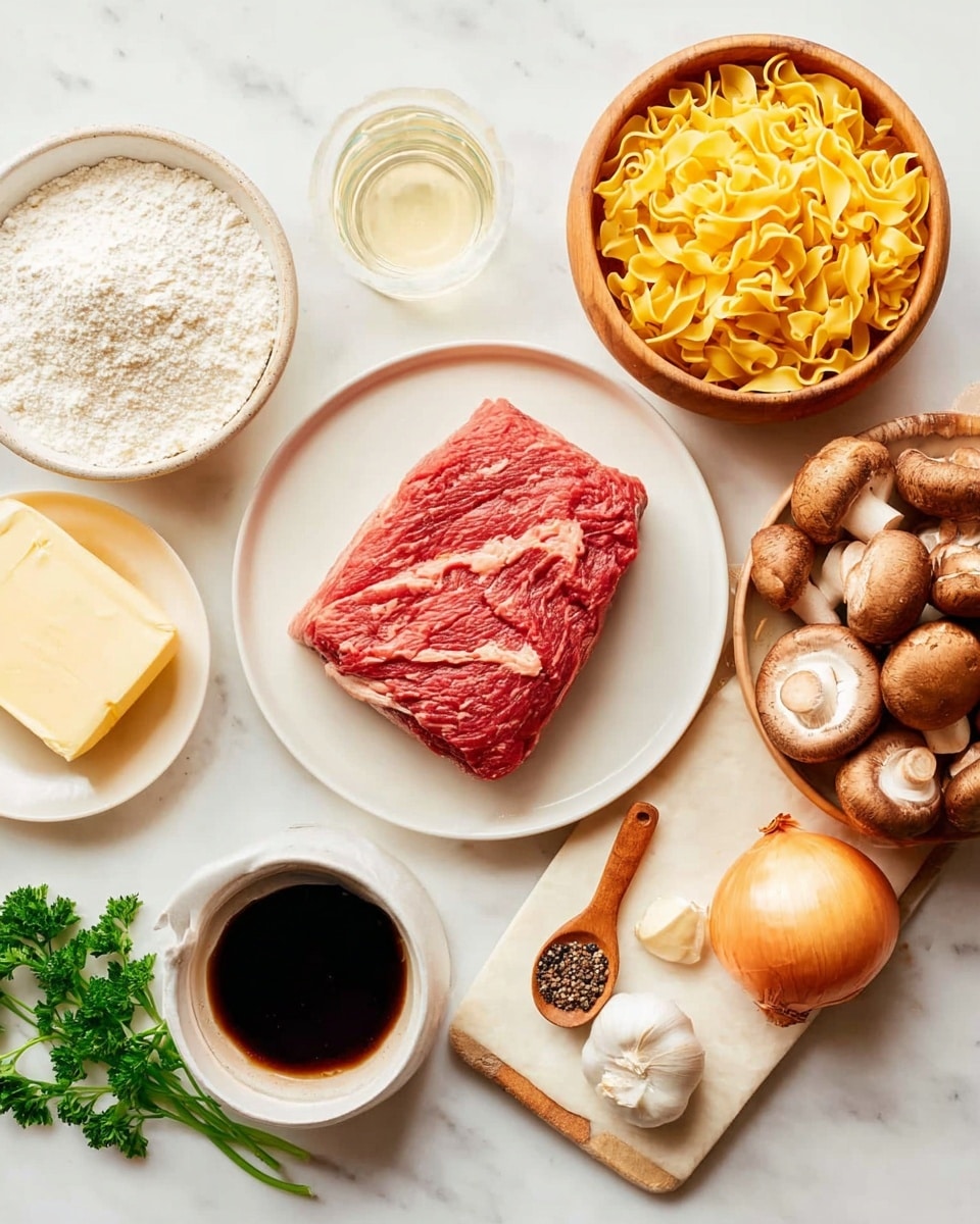 The image shows a white marbled surface with various raw cooking ingredients neatly arranged. In the center is a white plate holding a thick, red piece of raw meat with visible marbling. Surrounding it are a wooden bowl filled with yellow egg noodles on the right, three whole brown mushrooms, and a small white round bowl with dark soy sauce just below the meat. To the left are a small white bowl of white flour, a glass of clear liquid, a white plate with a stick of pale yellow butter, and a small cup of light brown liquid. At the top right on a small beige wooden cutting board are three whole garlic cloves, a wooden spoon holding black pepper, a sprig of green parsley, and a peeled white onion. photo taken with an iphone --ar 4:5 --v 7