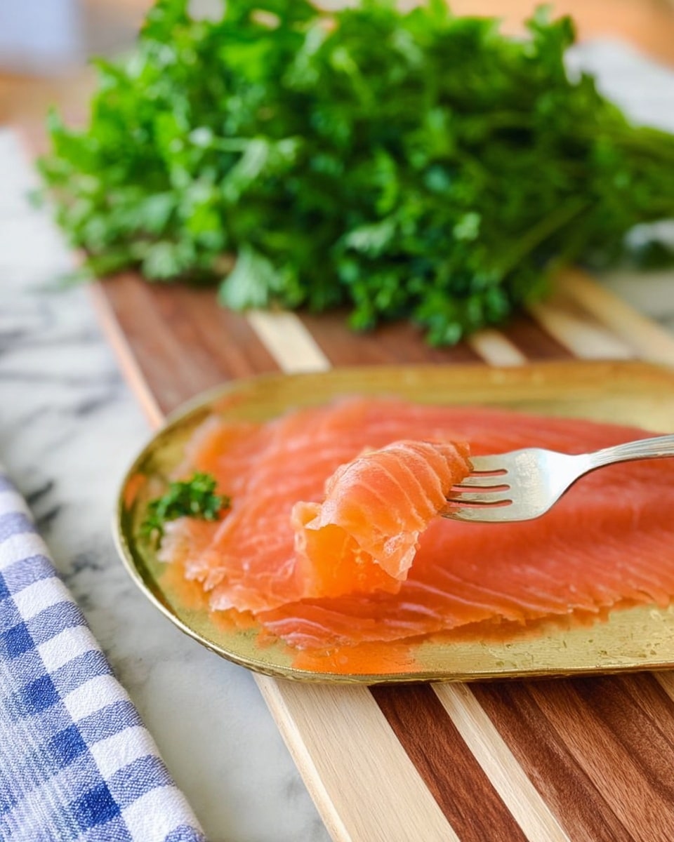 The image shows thin slices of pink smoked salmon arranged in one layer on a golden tray. A silver fork lifts one piece of the salmon, revealing its smooth, slightly shiny texture. The tray is placed on a wooden board with light and dark brown stripes, and in the background there is a bunch of fresh green parsley. The scene is set on a white marbled surface with a blue and white checkered cloth partially visible at the bottom left. photo taken with an iphone --ar 4:5 --v 7
