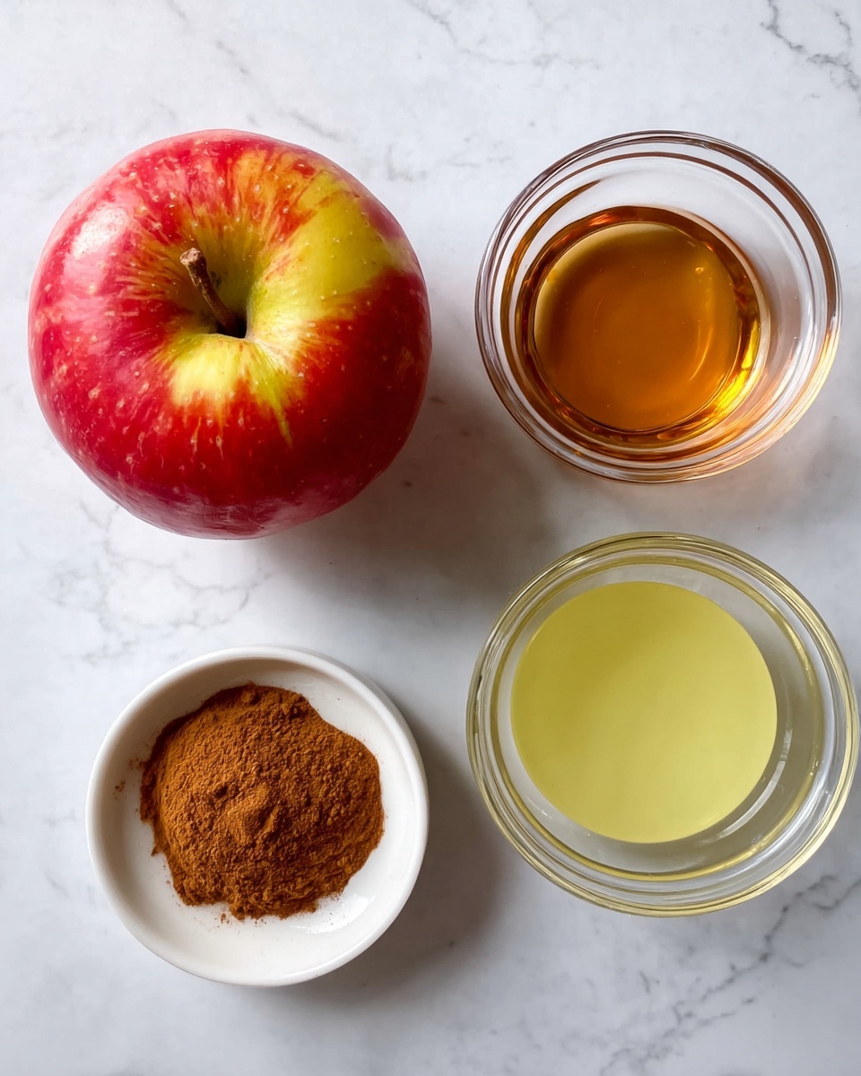 The image shows a white marbled surface with four items arranged in a square. In the top left corner, there is a whole red and yellow apple with a slightly shiny texture. To the top right, there is a small clear glass bowl filled with a light brown liquid. Below it on the bottom right, there is a white bowl containing a light yellow liquid with a smooth surface. On the bottom left, there is another small clear glass bowl holding a pile of brown powder with a fine texture. The overall arrangement is neat and spaced evenly. Photo taken with an iphone --ar 4:5 --v 7