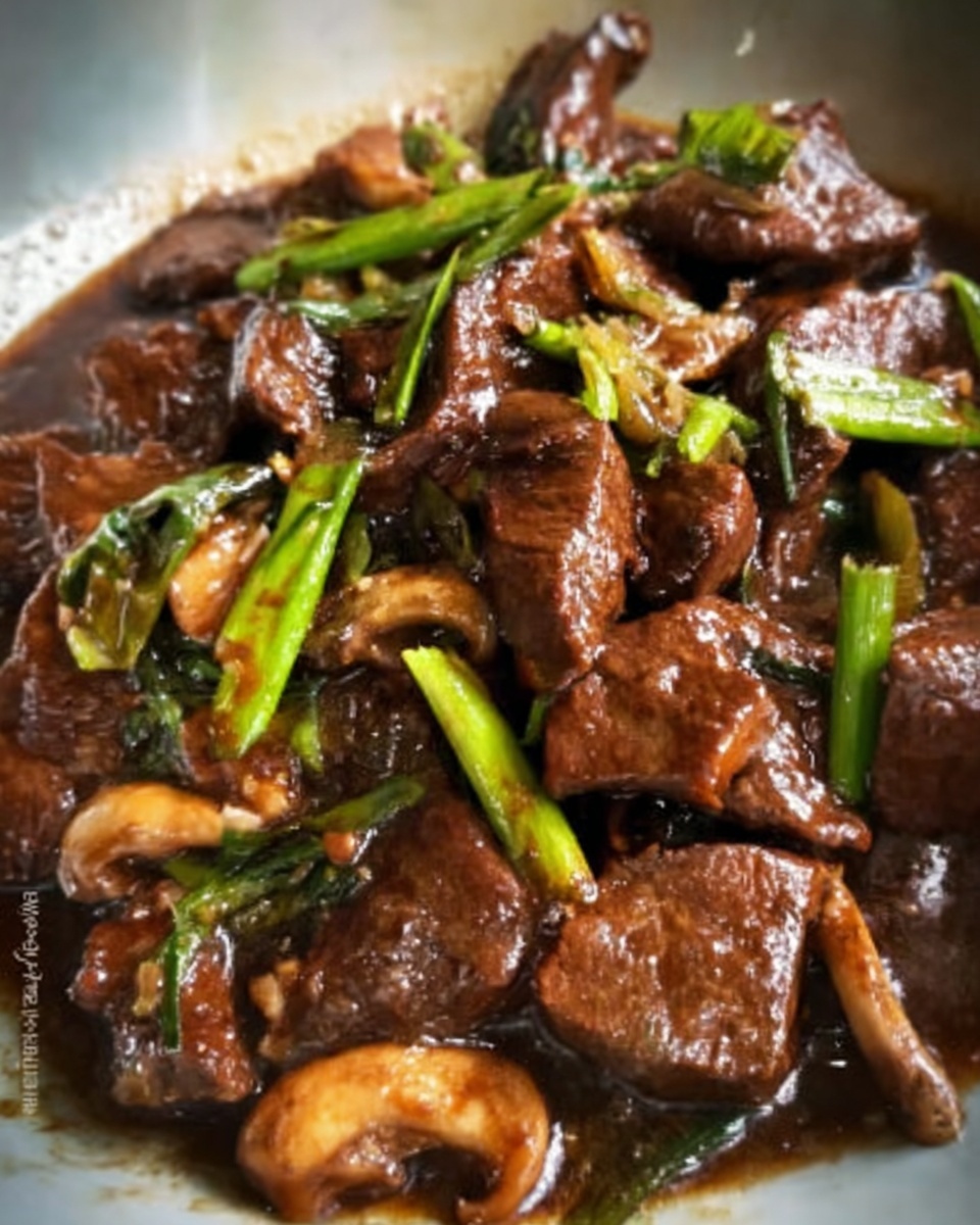 The image shows a close-up of dark brown cooked beef slices mixed with small green onion pieces and light brown mushrooms, all coated in a thick shiny brown sauce. The beef looks tender and slightly glossy, while the green onions add a fresh contrast. The dish sits on a white marbled surface, making the rich colors stand out clearly. photo taken with an iphone --ar 4:5 --v 7