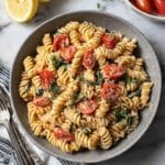Easy Hummus Pasta with Roasted Red Pepper, Tomatoes, and Spinach Recipe