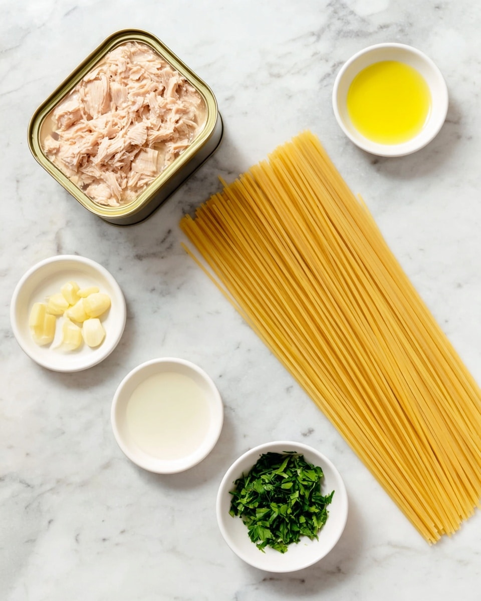On a white marbled surface, there is an open tin of light beige canned tuna with visible chunks showing inside. Next to it, on the right side, there is a bunch of uncooked spaghetti pasta, arranged parallel and lying flat. Below the tin, there are four small white dishes placed in a loose semicircle: the top left dish contains chopped pale yellow garlic, the top right dish holds a small amount of olive oil with a smooth yellow-green color, the bottom right dish has a small amount of clear white liquid, and the bottom left dish contains vibrant green chopped herbs. The scene is well lit, showing clear details of each ingredient. photo taken with an iphone --ar 4:5 --v 7