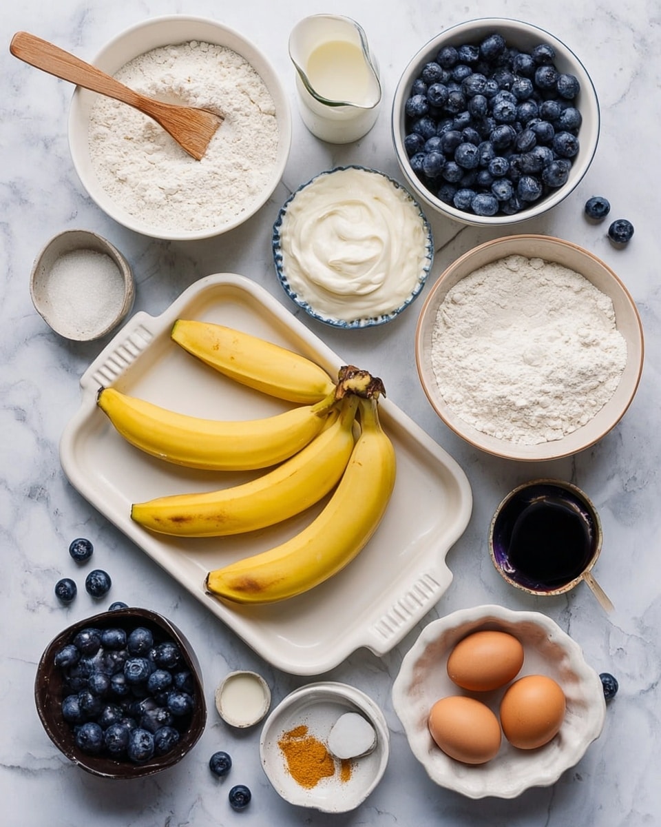 The image shows multiple ingredients neatly arranged on a white marbled surface. In the center is a white tray holding a few yellow bananas, some peeled and some whole, with scattered dark blue blueberries. Above to the right is a white bowl full of blueberries. To the left of the tray is a white bowl with thick white yogurt, and below it is another bowl filled with white flour and a wooden spatula inside. Above the yogurt bowl is a larger white bowl with flour. Beside the flour bowl is a small pitcher of milk with a few blueberries around it. Near the top center is a small scalloped dish holding white powder, and next to it is a small round bowl with dark liquid, likely vanilla extract. On the right side near the bottom is a dark bowl holding two brown eggs, and beside it is a small white dish with a spoon holding orange-brown spice. Below the eggs is a small white bowl with olive oil. Scattered blueberries decorate the scene. All bowls and dishes are white, resting on a white marbled surface. Photo taken with an iphone --ar 4:5 --v 7