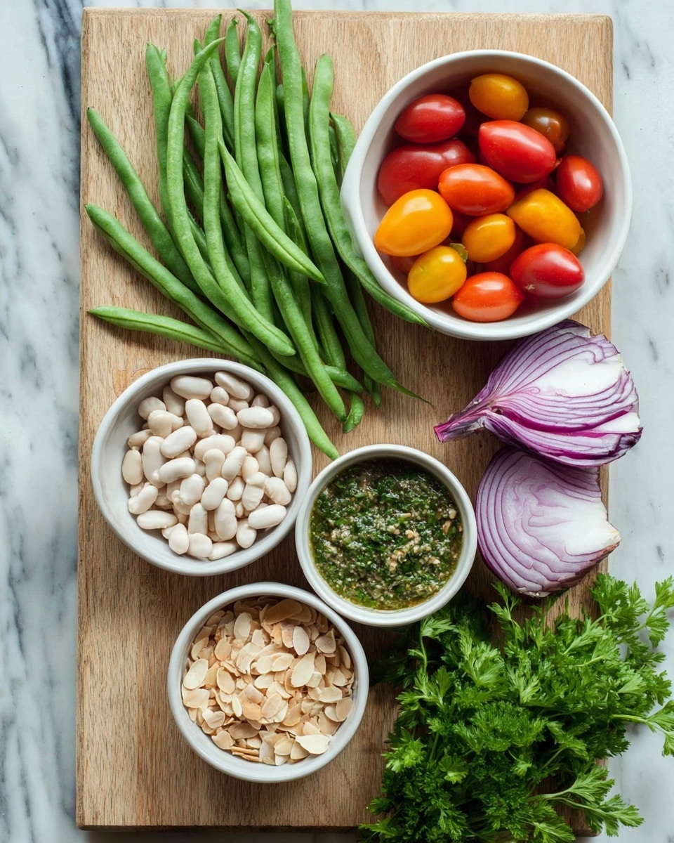 A wooden board on a white marbled surface holds fresh ingredients arranged neatly: a cluster of long green beans on the left, a white bowl of small white beans at the bottom left, a white bowl of toasted almond slices near the bottom center, and a white bowl with a green herb sauce in the center-right. Above that is a white bowl filled with red and yellow small tomatoes, beside half a red onion with purple and white layers, and some fresh green parsley sprigs at the bottom right. Photo taken with an iphone --ar 4:5 --v 7