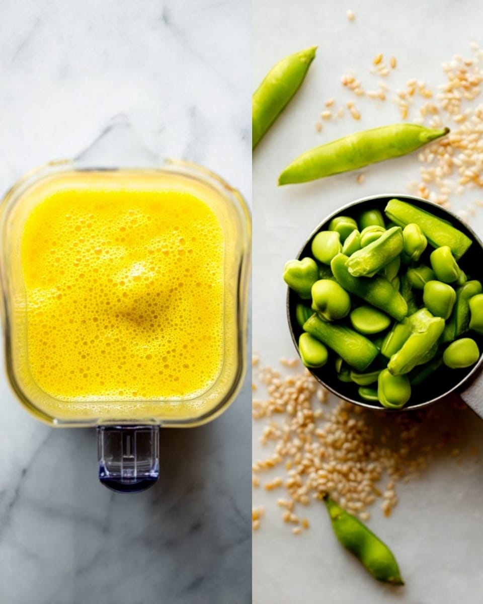 The image shows two close-up views side by side on a white marbled surface. On the left, a top view of a blender container filled with a bright yellow, smooth, and slightly bubbly liquid, creating a thick texture. The blender blades are visible at the bottom center, covered by the liquid. On the right, there is a silver measuring cup filled with green sliced pods, placed on the surface with more whole green pods scattered around it, along with some small beige seeds sprinkled nearby. photo taken with an iphone --ar 4:5 --v 7