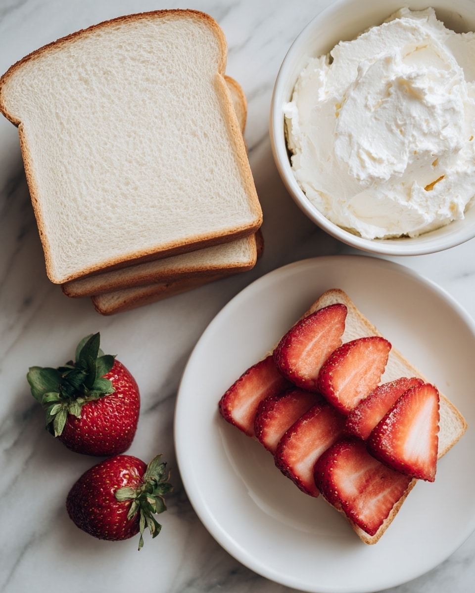 The image shows three layers: two pieces of white bread stacked slightly askew on the top left, a white bowl filled with soft cream cheese at the top right, and a white plate on the bottom right with thin, round slices of red strawberries arranged in a neat layer, along with two whole red strawberries with green leaves placed on the lower left side of the plate. The background is a white marbled surface. Photo taken with an iphone --ar 4:5 --v 7