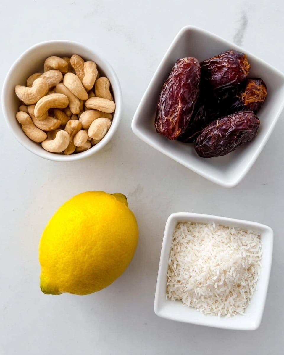 The image shows four small white bowls and one whole lemon on a white marbled surface. The top left bowl contains light brown cashew nuts with a smooth texture. The top right bowl holds dark brown dates, shiny and slightly wrinkled. The bottom right square bowl is filled with white, shredded coconut flakes that look soft and fine. Below the bowls, in the center, there is a bright yellow lemon with a smooth, slightly bumpy skin. photo taken with an iphone --ar 4:5 --v 7