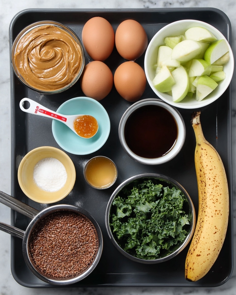 The image shows a black tray with different ingredients arranged neatly. On the top left is a small glass bowl filled with peanut butter. Below it are three brown eggs placed sideways. Below the eggs is a white and red measuring spoon holding a small amount of orange jam. Next to the peanut butter, there is a small light blue bowl with a dark brown liquid inside. In the middle, there is a small yellow bowl with white powder. Below that is a small beige bowl filled with brown flax seeds. To the right of the seeds, a small silver measuring cup contains rich brown cocoa powder. Above the cocoa is another silver measuring cup filled with chopped green kale leaves. At the top right side, a white bowl holds sliced green apple pieces. Finally, on the far right side of the tray, there is a ripe yellow banana with brown spots. The tray sits on a white marbled surface. photo taken with an iphone --ar 4:5 --v 7