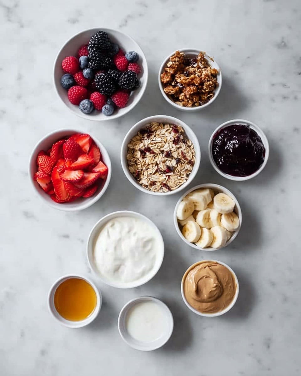 The image shows nine white bowls of different sizes on a white marbled surface, each filled with different ingredients. Starting from the top right and moving clockwise, the first bowl contains mixed fresh berries including raspberries, blackberries, and blueberries, all vibrant in red, black, and deep blue colors. Below it is a bowl filled with sliced red strawberries, bright and fresh. Next is a bowl with a crunchy granola mix, with visible pieces of oats and seeds in shades of brown and tan. Below this is a small bowl of a white creamy substance. On the bottom left side is a bowl of golden honey, shining under the light. Above this is a larger bowl of smooth white yogurt, creamy and thick in texture. Moving upwards is a bowl holding sliced bananas, yellow with some light brown spots. Above this is a smaller bowl filled with a light brown creamy spread, likely peanut butter. To the right of this is a bowl with a dark purple or black fruit spread or jam, thick and glossy. The bowls are arranged loosely in a circular pattern with plenty of white marbled space between them. photo taken with an iphone --ar 4:5 --v 7