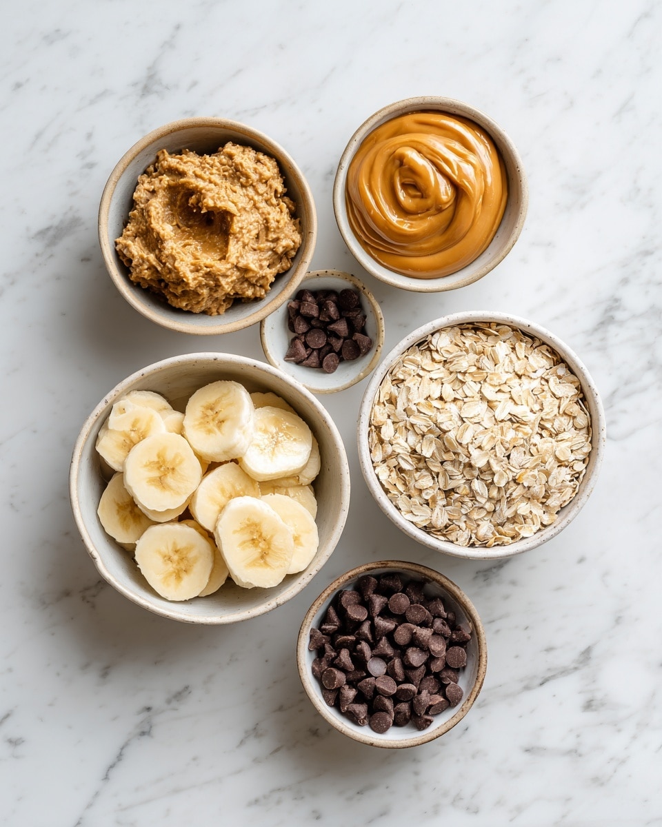 Top-down professional food photography, flat lay style, bright white marble countertop, neatly arranged, evenly spaced, tidy, clean organized layout, include: bowl of mashed bananas, small bowl of peanut butter, large bowl of rolled oats, small bowl of chocolate chips, bright soft natural lighting, sharp focus, high detail textures, realistic reflections, professional DSLR look, 4K, no finished dish, no cooked food, no hands, no text, no watermark, no brand logos --ar 4:5 --v 7