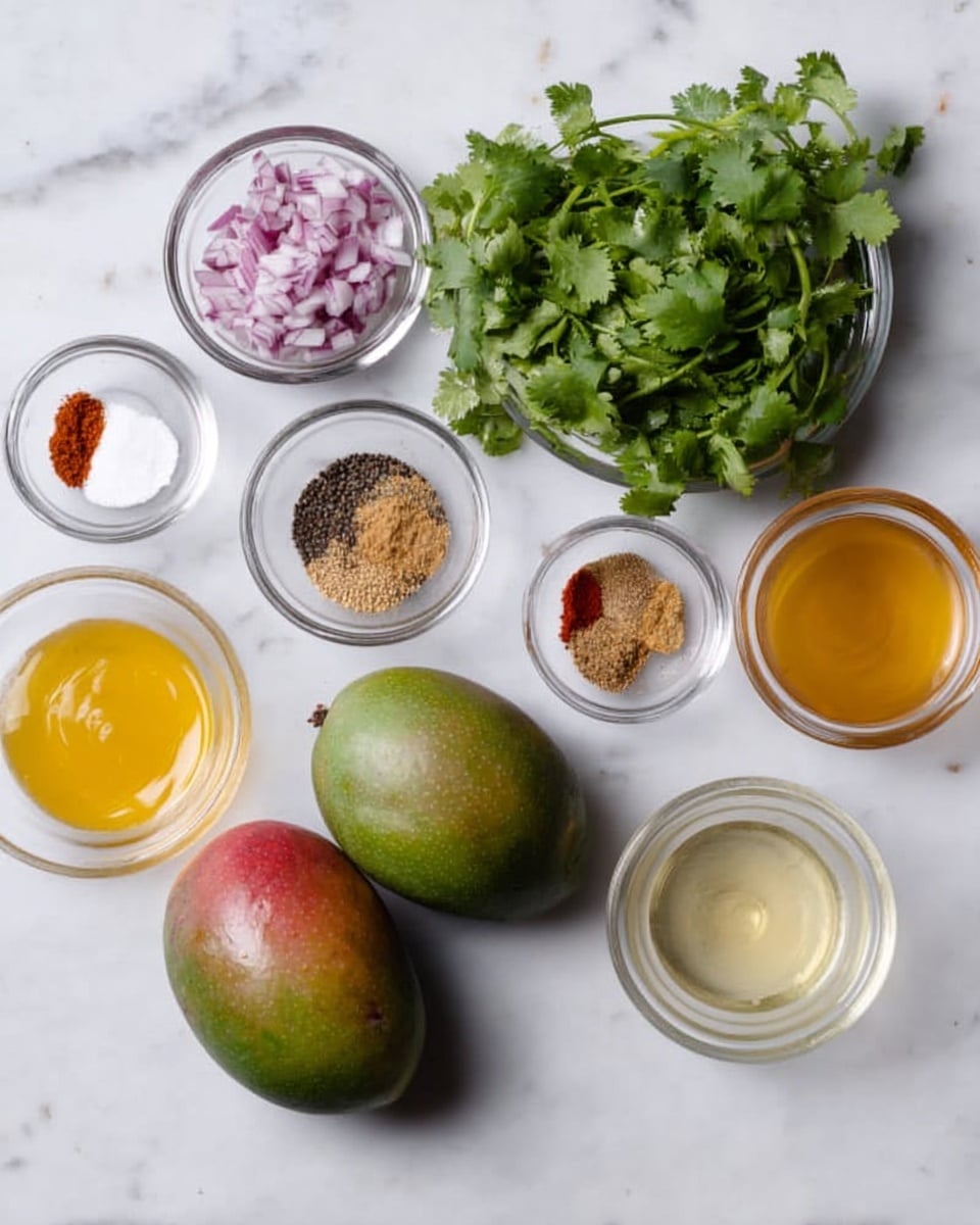 The image shows two whole mangoes with green and red skin placed on a white marbled surface. Around them are small clear glass bowls filled with different ingredients: one with chopped red onion, one with a light brown spice powder, one with salt, black pepper, and red chili powder, another with a pale yellow liquid, one with a golden liquid, and another with a clear light yellow liquid. There is also a small bunch of fresh green cilantro leaves in a clear bowl, all arranged neatly above and around the mangoes. The photo is taken with an iphone --ar 4:5 --v 7