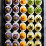 Halloween Deviled Eggs with Eyeball, Pumpkin, Spooky Green, and Spider Decorations Recipe