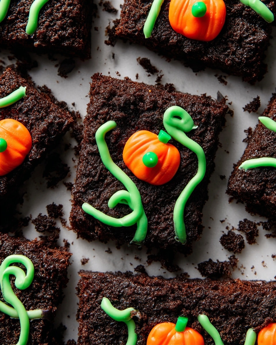 The image shows several square brownies with a dark, crumbly chocolate layer on top, placed on a white marbled surface. Each brownie has an orange pumpkin-shaped candy with a bright green center sitting on the surface. Thin, bright green icing lines swirl around each pumpkin candy, creating vine-like patterns that stretch across the brownies. The brownies are arranged close to each other, showing the rough texture of the chocolate and crumbs scattered around. The contrast between the dark brown, bright orange, and vibrant green colors stands out clearly. photo taken with an iphone --ar 4:5 --v 7