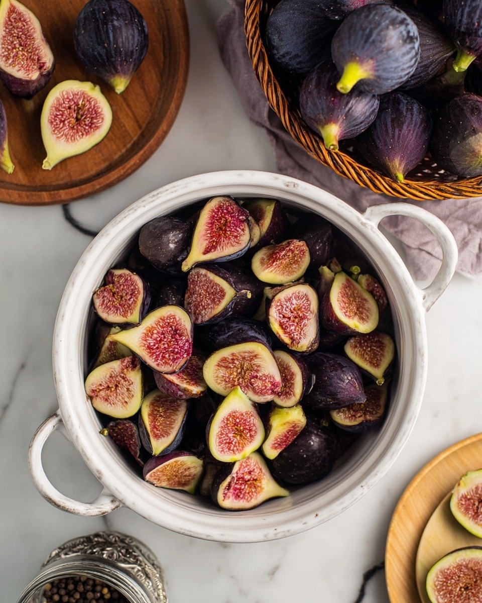 A white pot is filled with many dark purple figs that are cut in halves or quarters, showing their pinkish-red seeded inside. Above the pot, there is a basket full of whole dark purple figs with green stems. To the right, a white marbled surface holds a light wooden plate with halved figs showing the same pink inside. At the bottom left corner, there is a small glass bowl with black peppercorns and a silver container next to it. The scene is set on a white marbled surface. photo taken with an iphone --ar 4:5 --v 7