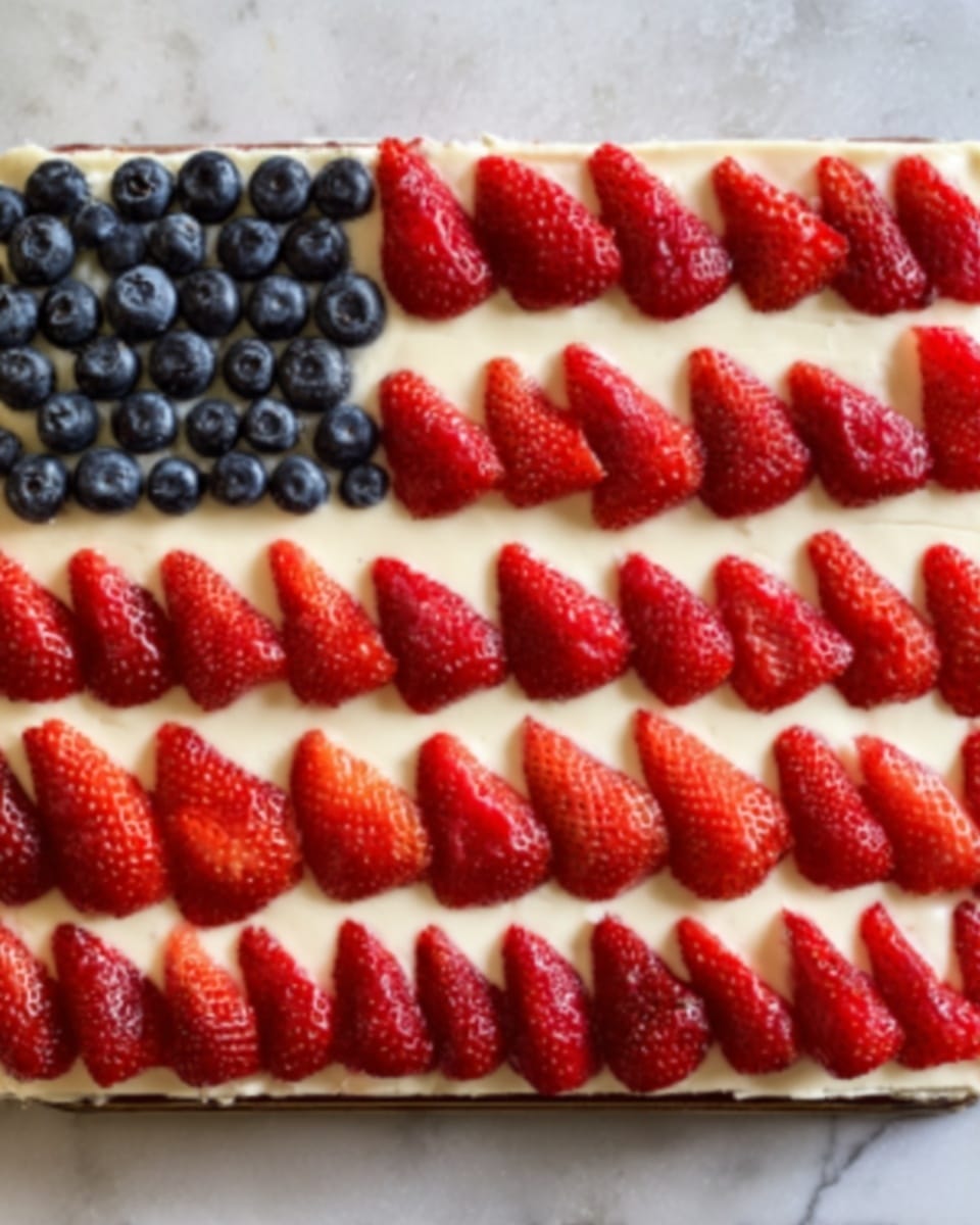The image shows a rectangular dessert with five layers, arranged like the American flag. The top left corner has a deep blue layer made of tightly packed blueberries. Next to it and filling the rest of the dish are alternating stripes of fresh sliced strawberries and a smooth white creamy layer, with seven strawberry stripes and six white stripes in total. The strawberries are thinly sliced and placed in overlapping rows, creating a textured look, while the white creamy layer is smooth and flat. The dessert sits on a white marbled surface. photo taken with an iphone --ar 4:5 --v 7