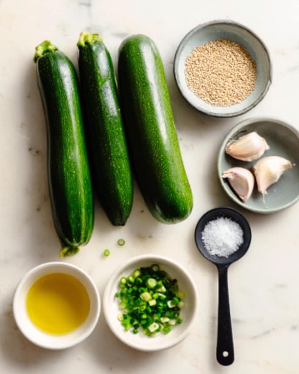 The image shows a soft light setting on a white marbled surface with three whole fresh zucchinis placed side by side in the top left corner. Nearby, there are small white bowls containing light golden oil and chopped green onions. A small gray bowl holds light brown sesame seeds. Two peeled garlic cloves are placed near the top right corner, and a shiny black spoon filled with white salt is positioned on the right side. The colors are mostly green from the zucchinis and onions, white from the bowls and garlic, and hints of brown and gold from the sesame seeds and oil. The setup is simple and organized, ready for cooking photo taken with an iphone --ar 4:5 --v 7