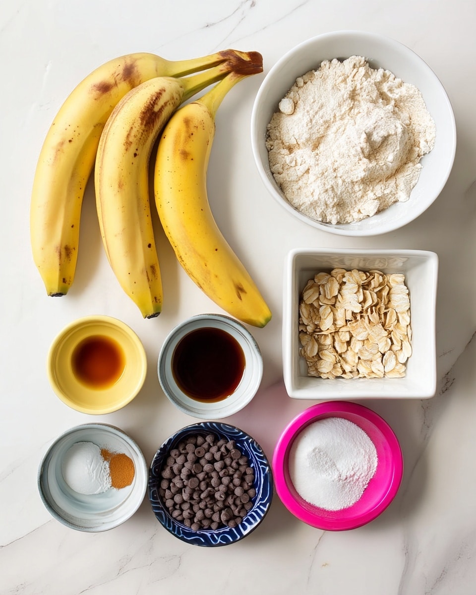 The image shows several ingredients arranged neatly on a white marbled surface. There are three ripe yellow bananas with brown spots placed near the top left and right sides. A white bowl holds a heap of white flour near the top center. Below it, a small square white bowl contains rolled oats. There are also a few small round white bowls with different ingredients: one filled with dark brown maple syrup, another with a small amount of vanilla extract, a third one has white flour and baking powder sprinkled with a tiny cinnamon portion, and a pink bowl filled with small dark chocolate chips. The scene is bright and clean. photo taken with an iphone --ar 4:5 --v 7