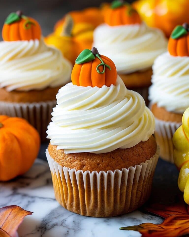 Pumpkin Cupcakes with Cream Cheese Frosting and Candy Pumpkin Garnish Recipe