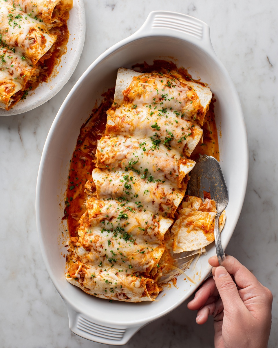 A white oval baking dish holds eight rolled tortillas filled with melted cheese and red sauce, sprinkled lightly with green herbs. A woman's hand is picking up one rolled tortilla near the front, showing its filling of orange melted cheese and chunks inside. A spatula with some melted cheese on it rests inside the baking dish on the left side. In the background, there is another white oval dish, filled with more rolled tortillas and the scene sits on a white marbled surface. photo taken with an iphone --ar 4:5 --v 7